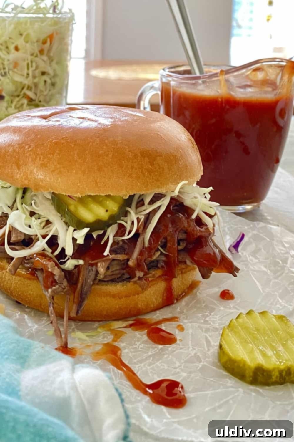 Easy Homemade BBQ Sauce 9 A mouth-watering brisket sandwich generously topped with homemade BBQ sauce, highlighting its perfect pairing.