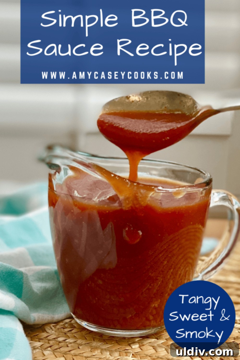Simply Delicious Homemade BBQ Sauce 10 A pristine white spoon holding a generous dollop of rich, homemade BBQ sauce, emphasizing its thick, glossy texture and appetizing appeal.
