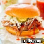 beef brisket piled on a bun with cole slaw