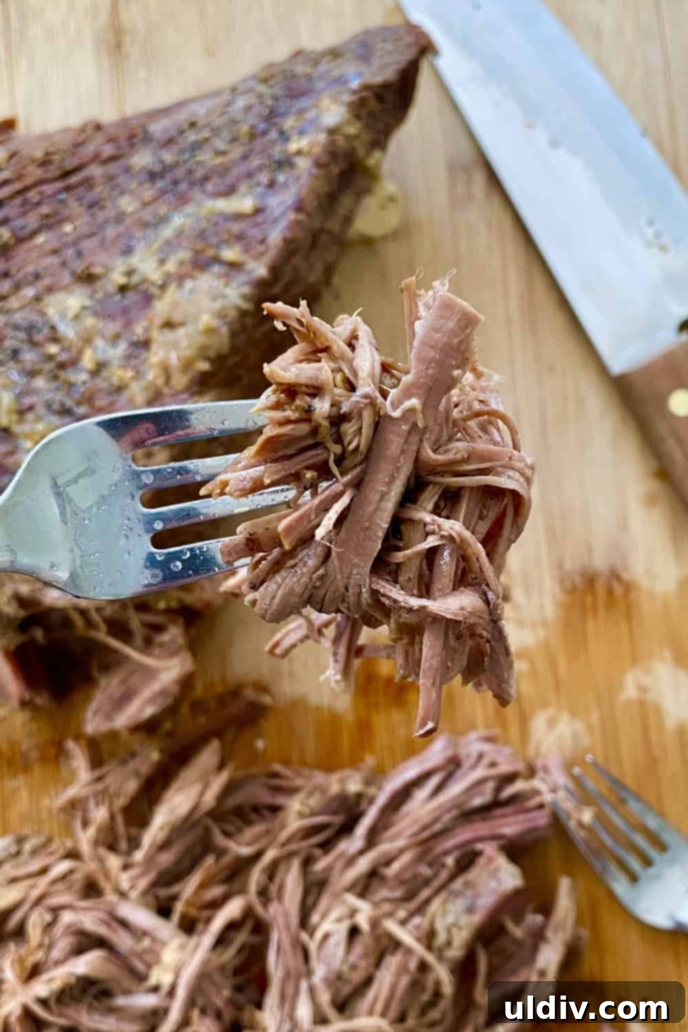 Tender Instant Pot BBQ Brisket Sandwiches 8 Shredded beef brisket in a bowl, moist and ready for sandwich assembly.