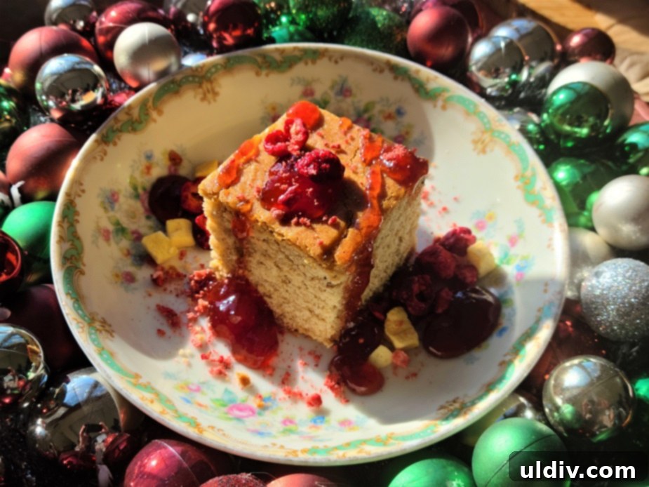 A Fresh Take On Holiday Spice Cake 5 Several slices of finished spice cake, beautifully arranged with various toppings including fresh berries and fruit preserve, ready for serving.