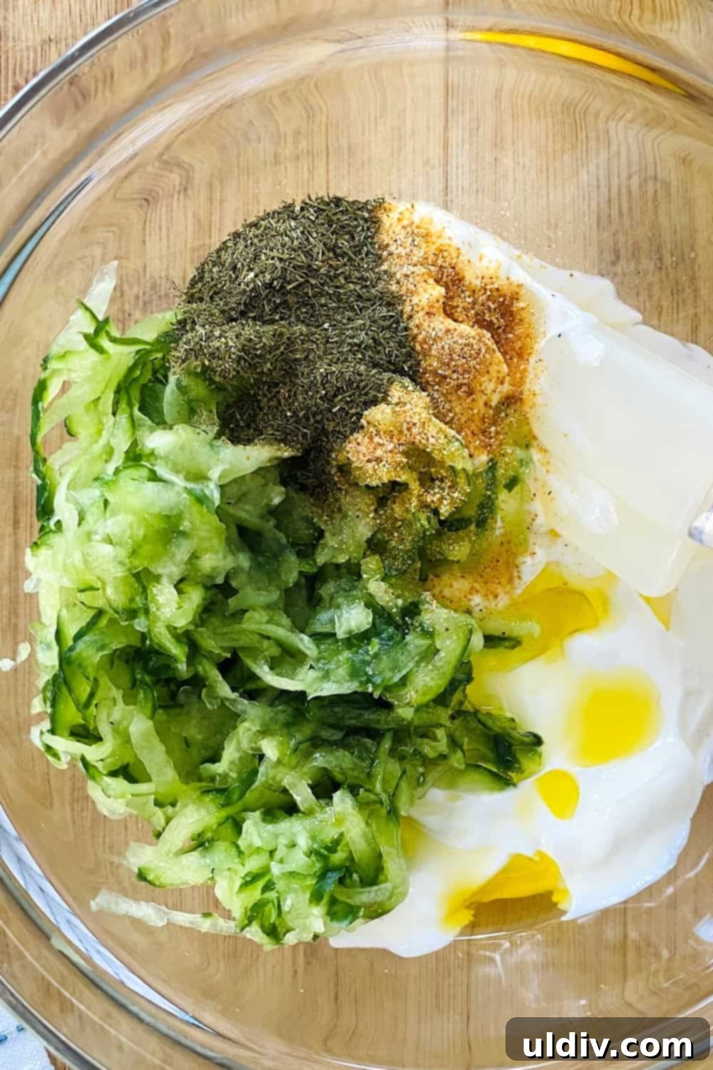 Versatile Easy Tzatziki Sauce 3 cucumber, yogurt, dill, garlic powder in a bowl