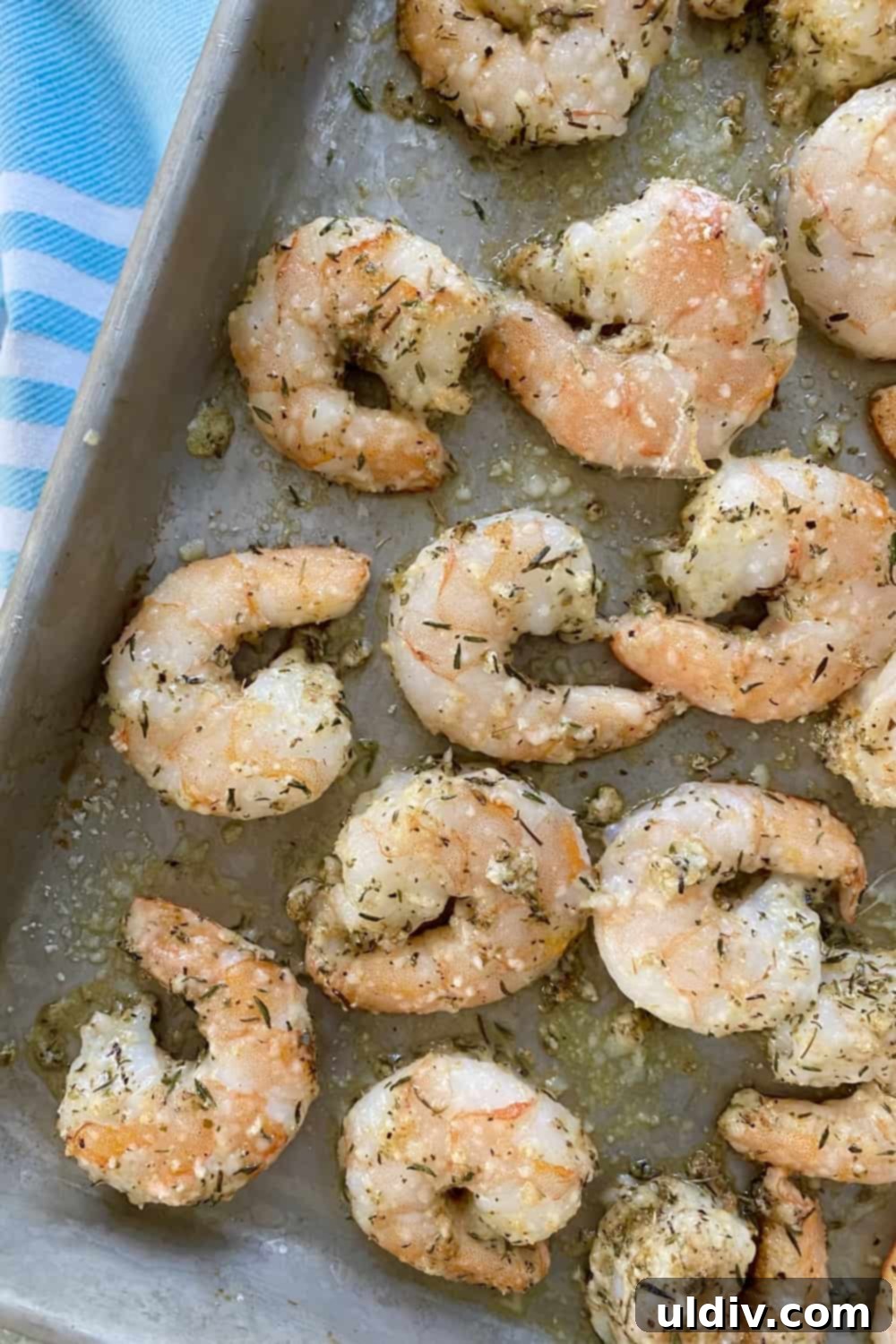 Crispy Parmesan Roasted Shrimp 2 Roasted shrimp with Parmesan and garlic on a baking sheet.