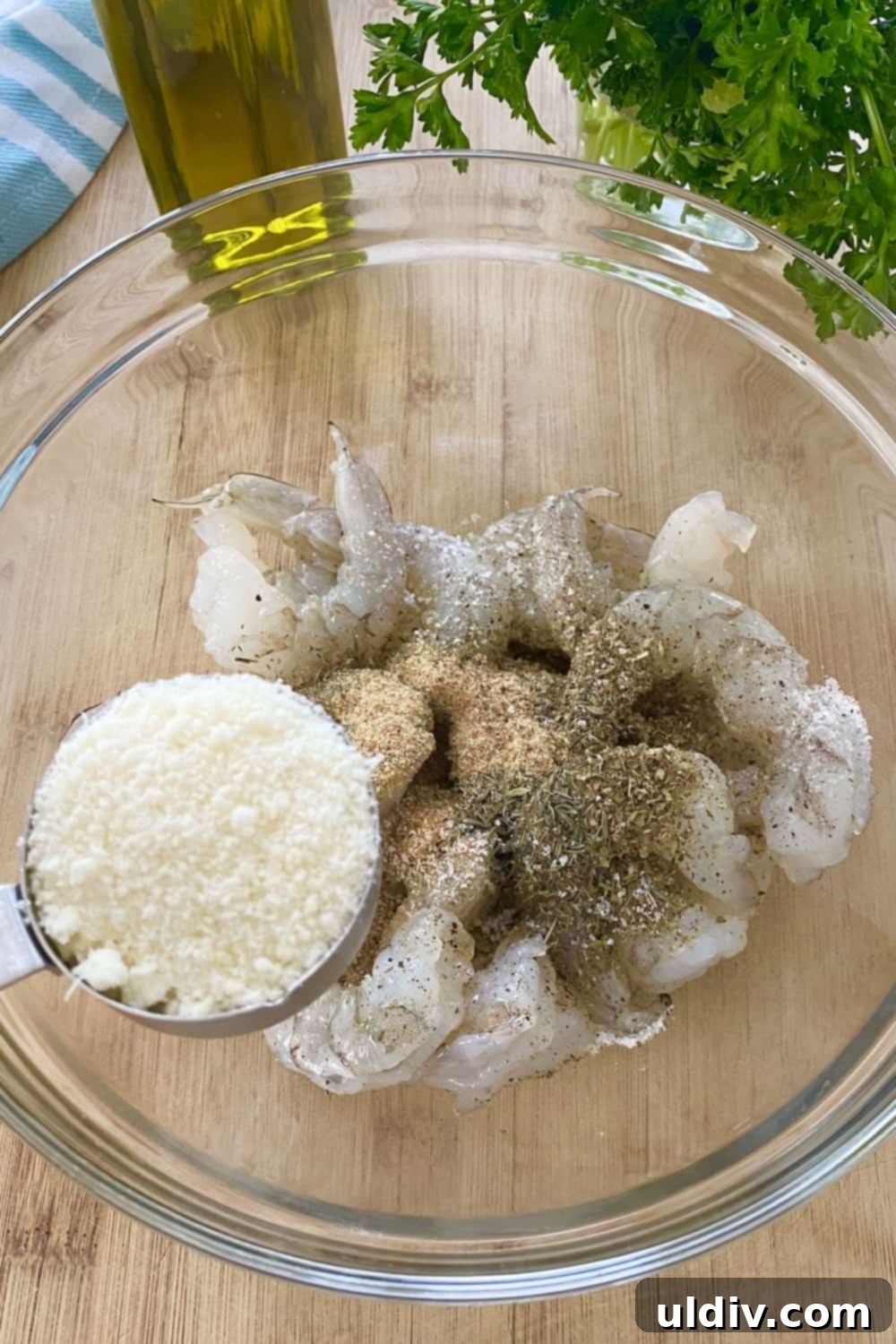 Crispy Parmesan Roasted Shrimp 5 Adding grated parmesan cheese to seasoned shrimp.