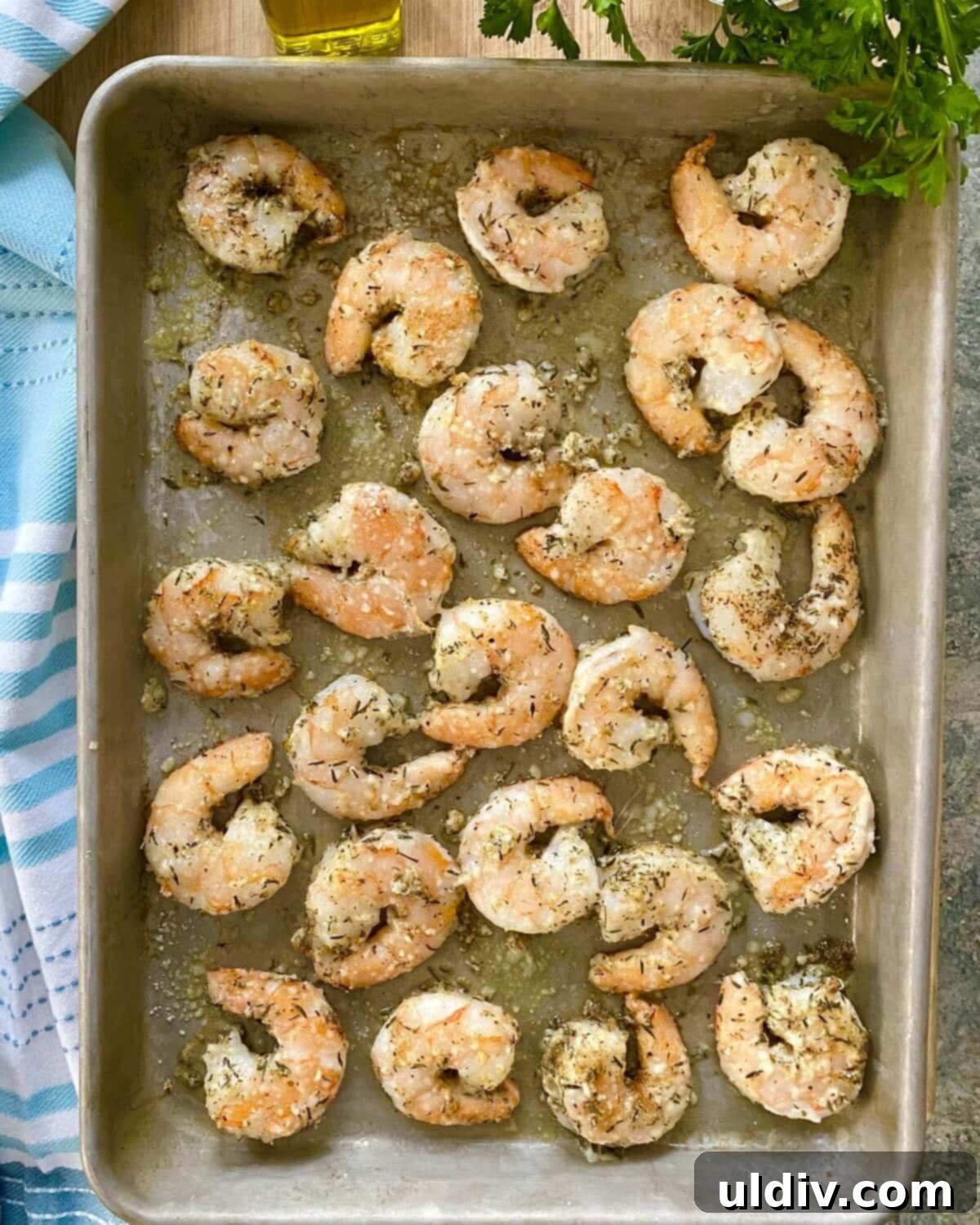 Crispy Parmesan Roasted Shrimp 9 A sheet pan with cooked shrimp.