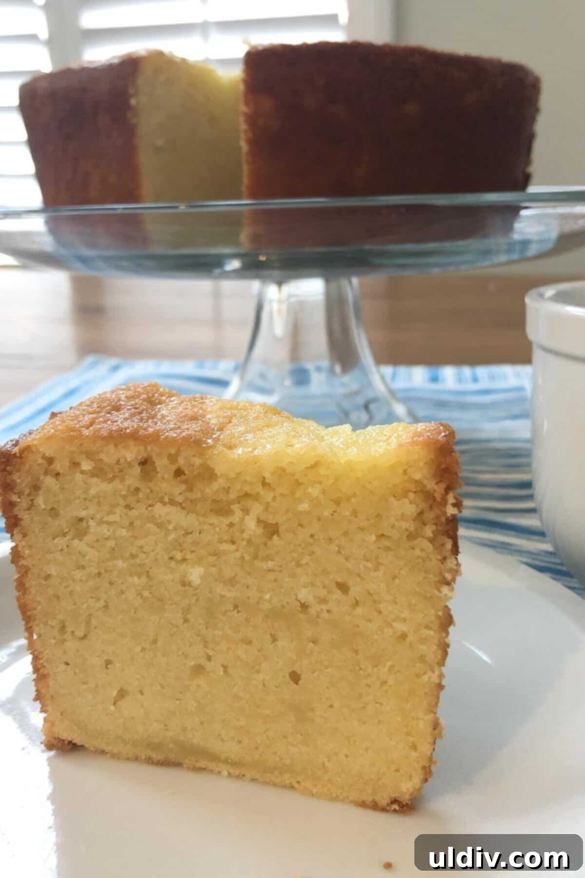 Classic Vanilla Pound Cake 2 a slice of sour cream pound cake and a whole cake.