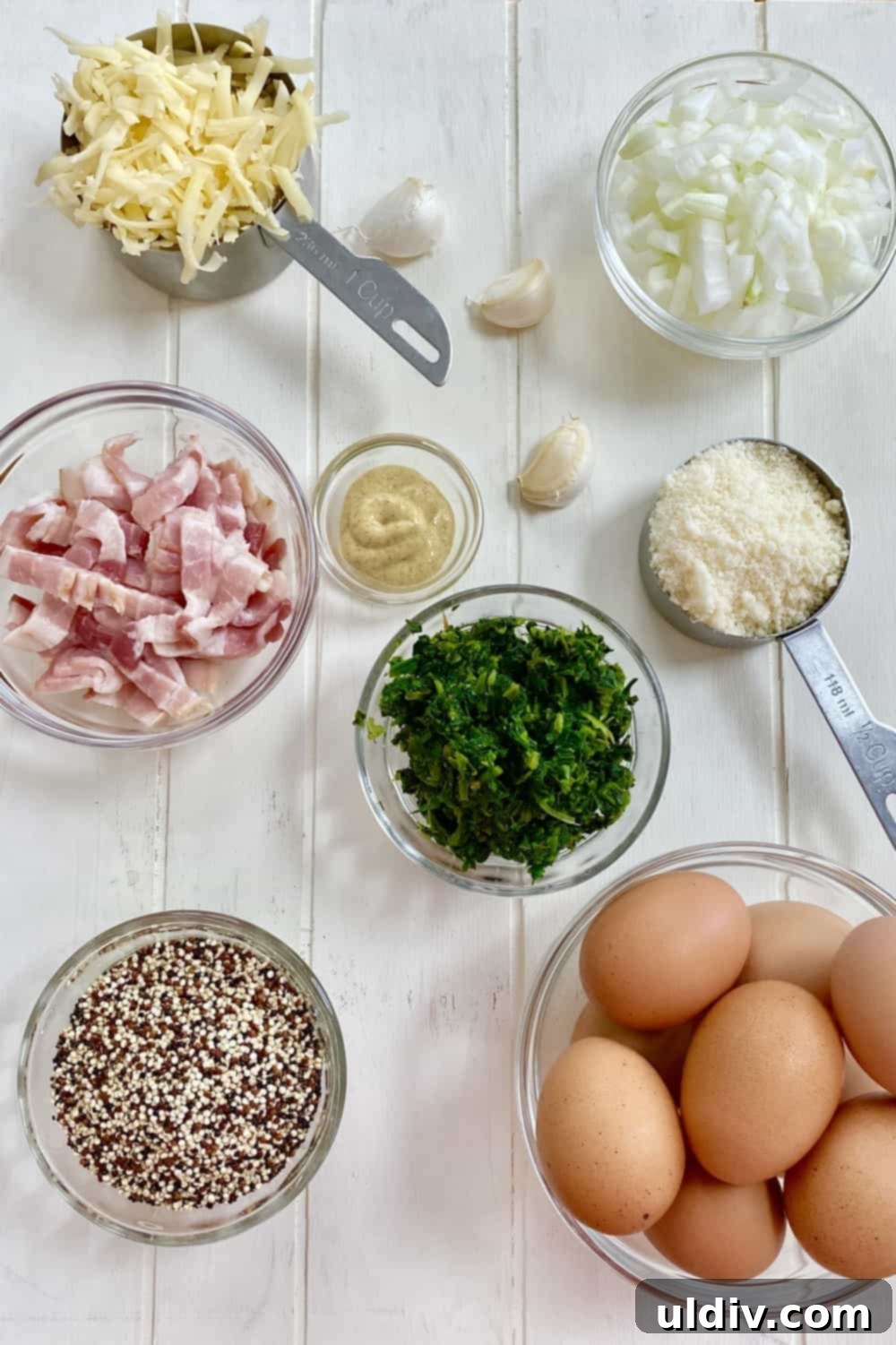 Your Grab-and-Go Morning: Protein-Packed Quinoa Egg Bites 3 Fresh ingredients laid out for Quinoa Egg Muffins: quinoa, eggs, spinach, onion, bacon, and various cheeses.