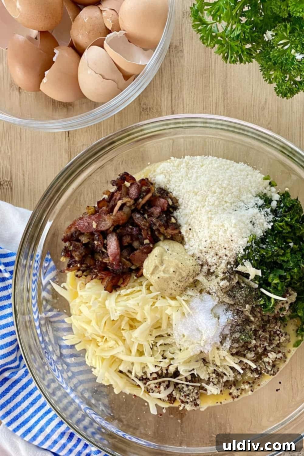 Your Grab-and-Go Morning: Protein-Packed Quinoa Egg Bites 6 A colorful array of ingredients for quinoa egg muffins, including eggs, cheese, spinach, quinoa, and bacon.