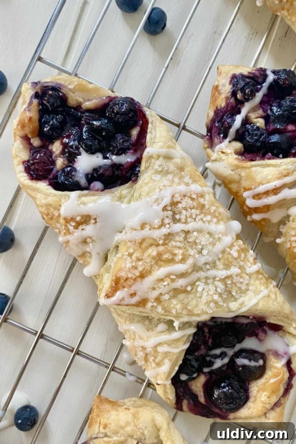Blueberry Cream Cheese Danish Bliss 2 A perfectly baked blueberry and cheese danish with flaky crust and glistening blueberries.