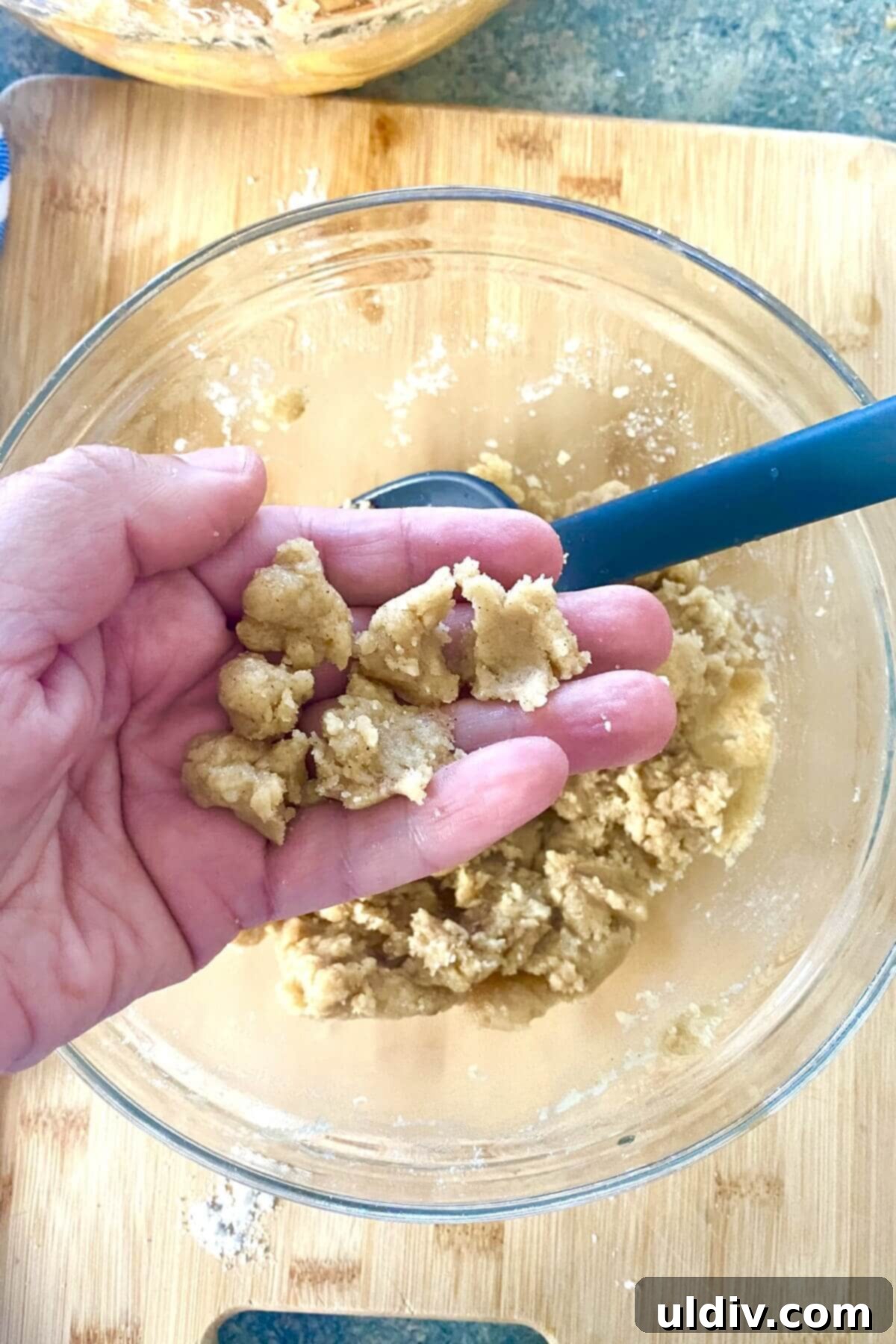Crisp Bottom Peach Crumble Pie 8 A bowl of freshly prepared crumble pie topping with marble-sized crumbs.