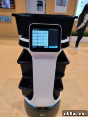 Experiencing and Evaluating the 2023 National Restaurant Association Show 16 A robot server demonstrating its capabilities on the show floor