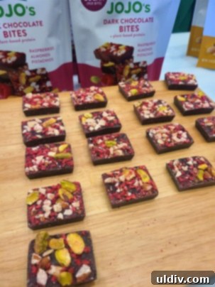 Unwrap Pure Joy: The 2023 Sweet & Snack Spectacle 14 Jojo's Chocolate display with branding