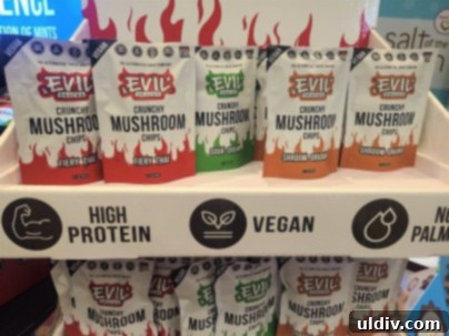 Unwrap Pure Joy: The 2023 Sweet & Snack Spectacle 20 Evil Snacks mushroom chips display