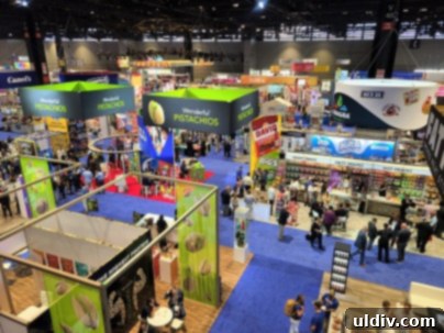 Unwrap Pure Joy: The 2023 Sweet & Snack Spectacle 7 Expo floor showing various snacks
