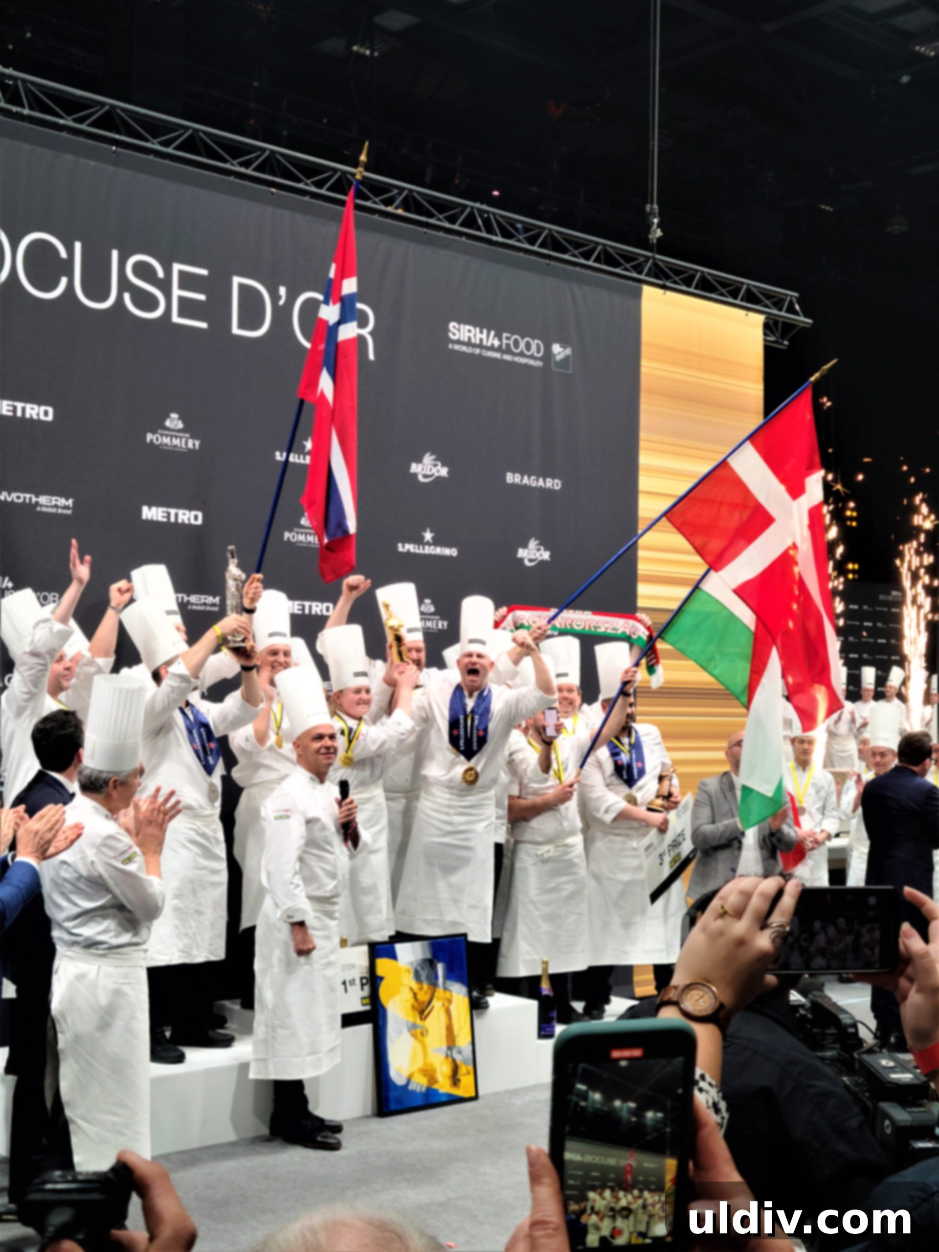 Beyond the Grid An Interview with the ForkYeahFoodies Community 14 A candid moment capturing the camaraderie and family-like atmosphere among culinary professionals at Sirha Lyon.