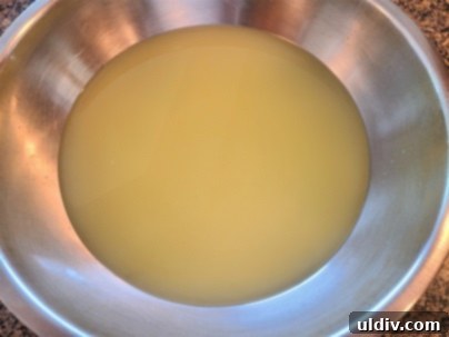 The Sour Milk Secret Homemade Cheese and Happy Memories 7 Whey collected in a bowl, ready for use