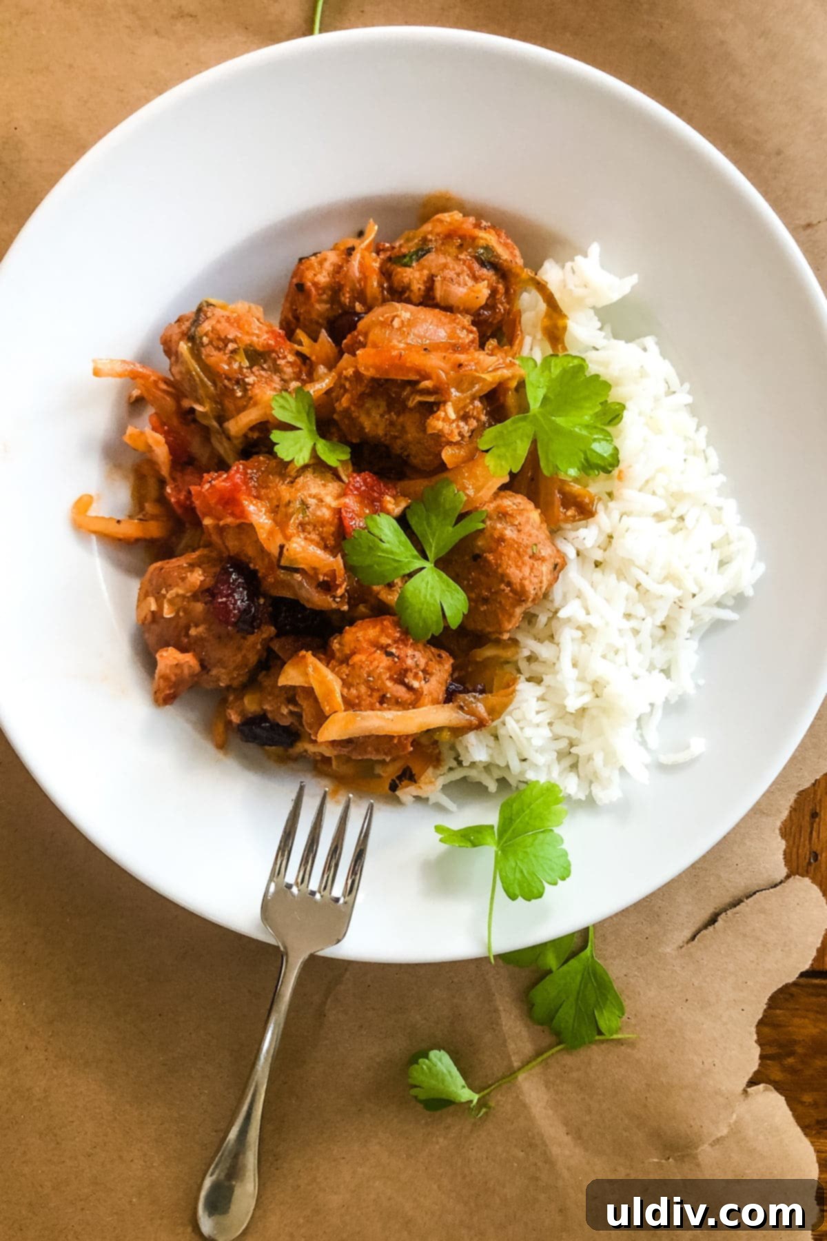 Cabbage Roll Meatball Bake 4 A hearty bowl of Cabbage Roll Meatballs served over fluffy white rice, ready to be enjoyed