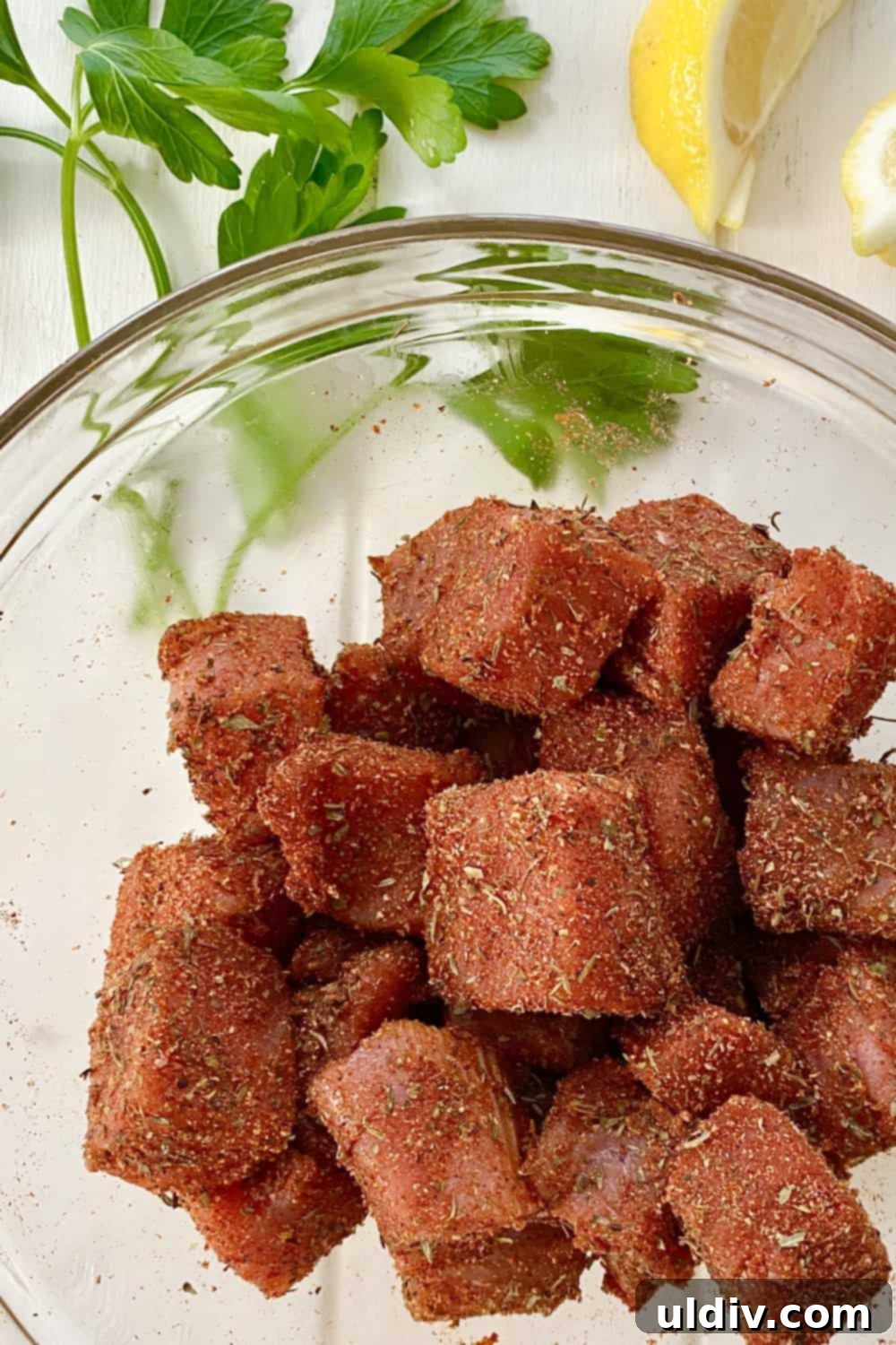 Spiced Tuna Poppers with Tangy Pickle Dip 7 Cubed fresh tuna seasoned generously with the homemade blackened spice blend, ready for searing.