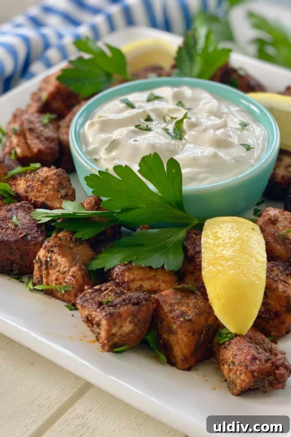 Spiced Tuna Poppers with Tangy Pickle Dip 9 A beautiful platter featuring perfectly blackened tuna bites, artfully arranged with a bowl of sweet pickle dipping sauce, ready to be served.