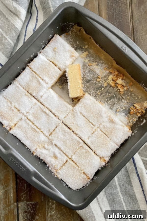 New York Times-Approved Sugared Shortbread 6 A baking pan filled with golden-brown, all-butter sugared shortbread cookies, freshly baked and ready for slicing.