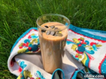 Naked Nutrition Chocolate Pea Protein Powder A Deliciously Wholesome Review 5 A delicious smoothie made with Naked Nutrition Chocolate Pea Protein Powder, garnished with strawberries.