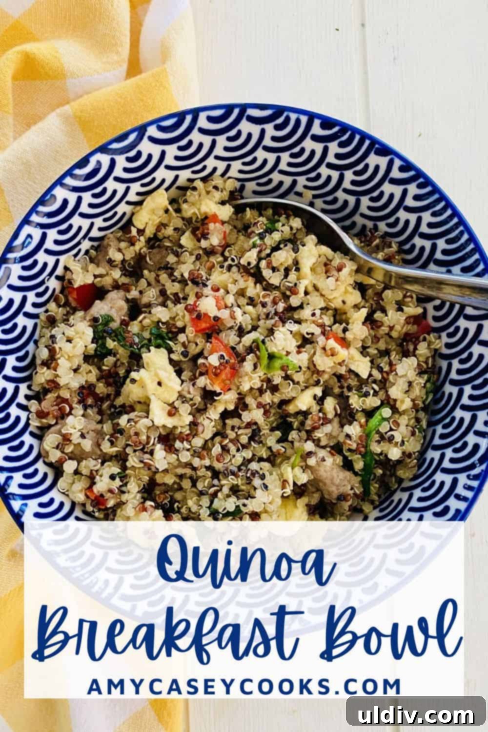 The Savory Quinoa Kickstart: Eggs, Sausage & Spinach 11 A spoon in a savory quinoa breakfast bowl.