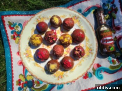 El Yucateco's New Hot Sauces: Versatile Delights from the King of Flavor 10 Several vegan truffles arranged artfully on a dark surface, highlighting their delicious appearance