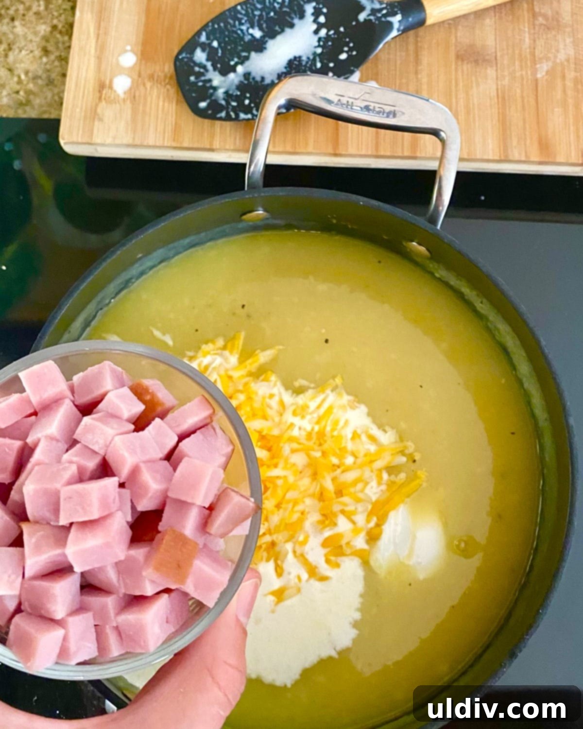 30-Minute Easy Cheesy Ham and Potato Soup 6 adding cheese, sour cream and ham to chowder.