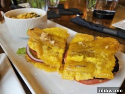 Marina's Bistro and Rum Bar A Spectacular Puerto Rican Flavor Adventure 7 Plant-based Jibarito with marinated portabella mushrooms, lettuce, onion, and tomatoes served between fried plantains