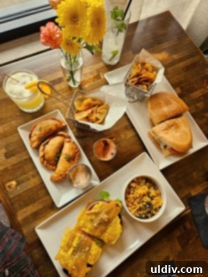 Marina's flavorful Pollo Sandwich, featuring marinated chicken thigh in a tender bun, served with crispy plantain chips