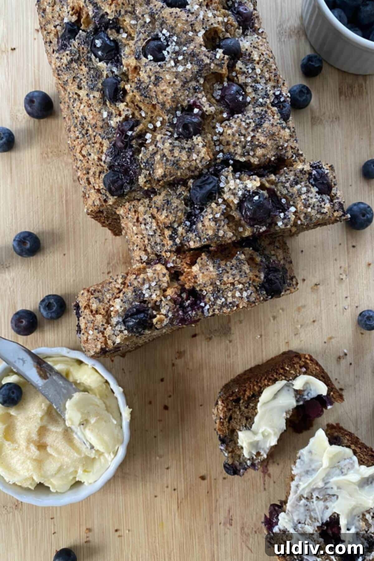 Mediterranean Olive Oil Banana & Blueberry Loaf 8 sliced banana bread and butter.