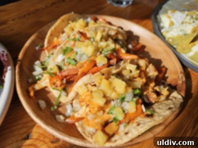 Savoring Amerikas A Delicious Dive into Nuevo Latino Flavors 9 Delicious vegetarian tacos filled with cauliflower, carrots, pineapple, cilantro, and onion.