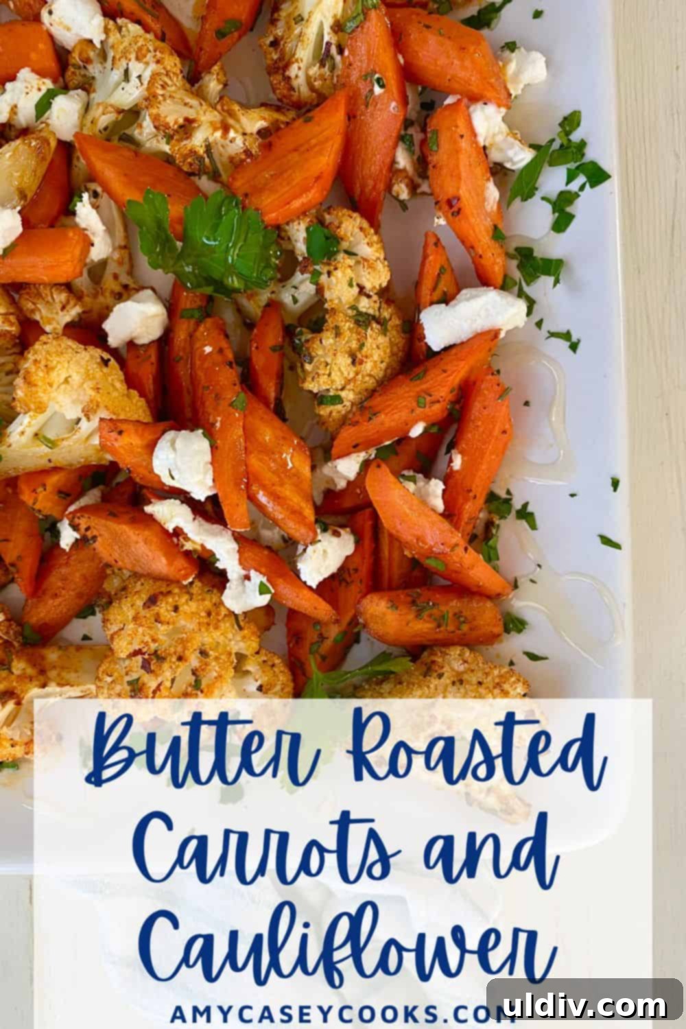 Honey-Glazed Roasted Carrots and Cauliflower with Tangy Goat Cheese 11 A beautifully arranged plate of roasted carrots and cauliflower with goat cheese, perfect for sharing on Pinterest.
