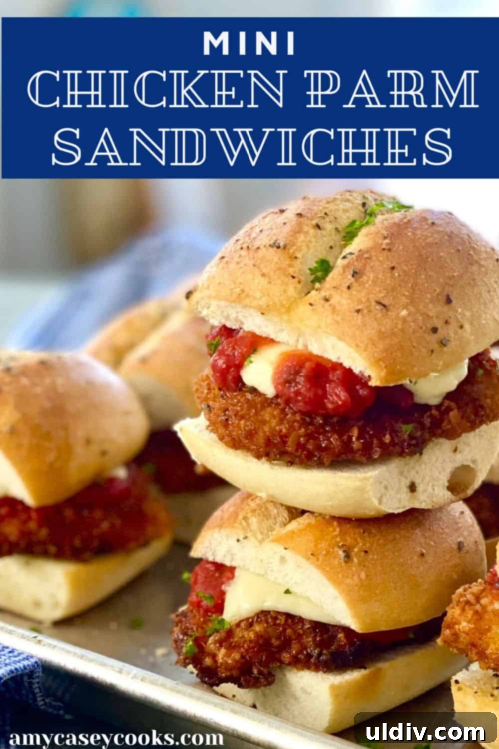 Mini Chicken Parm Sliders 9 A beautifully plated stack of mini chicken parm sandwiches, ready to be served.