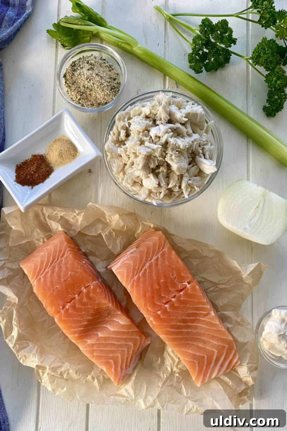Regal Salmon Crab Delight 3 Ingredients for crab stuffed salmon: salmon fillets, mayonnaise, breadcrumbs, celery, onion, and Old Bay seasoning.