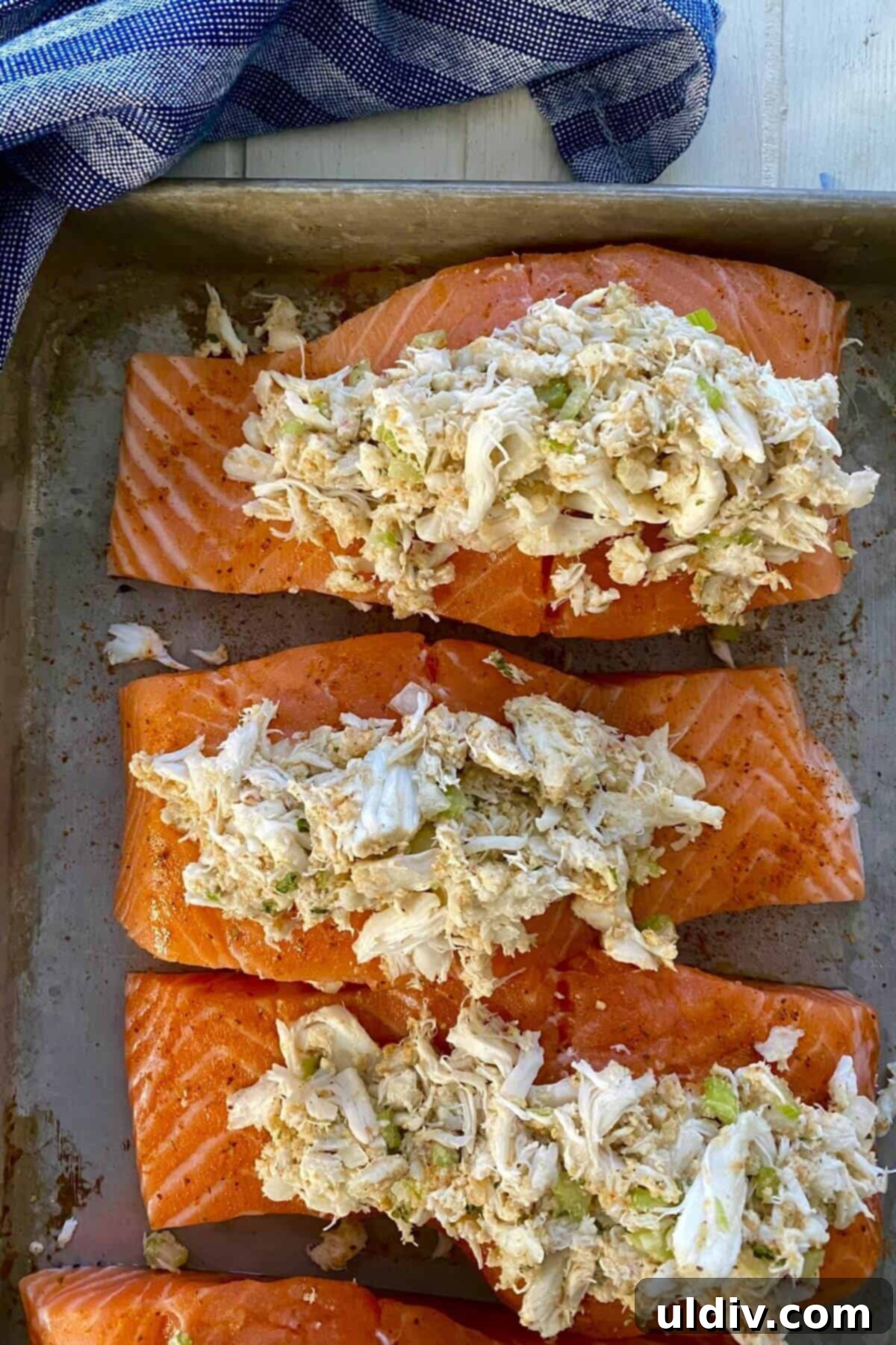 Regal Salmon Crab Delight 7 Close-up of a salmon fillet generously stuffed with crab meat, ready for the oven.