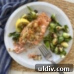 Regal Salmon Crab Delight 9 A piece of crab stuffed salmon served with roasted Brussels sprouts.