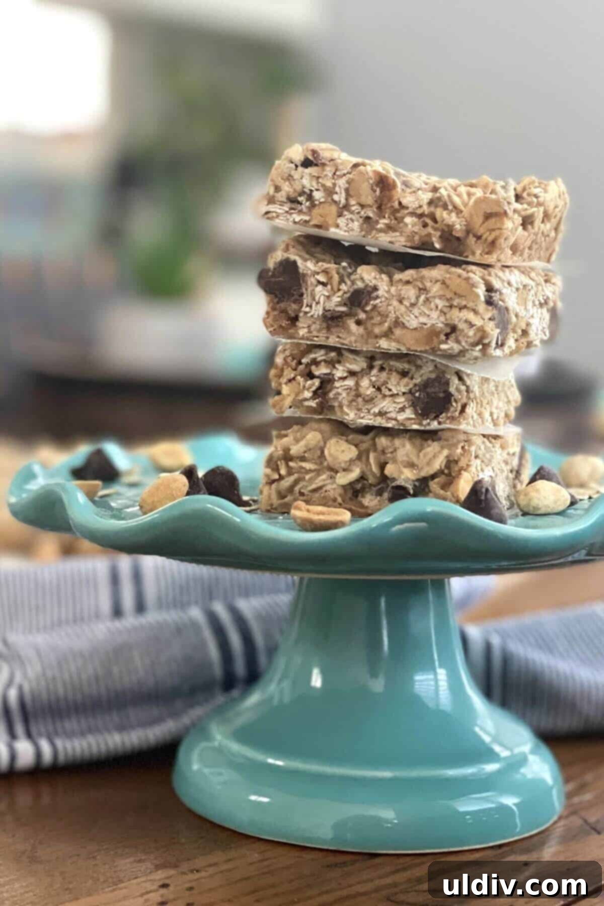 Chewy Chocolate Chip Peanut Butter Oat Bars 3 A stack of golden brown peanut butter oat bars on a plate.