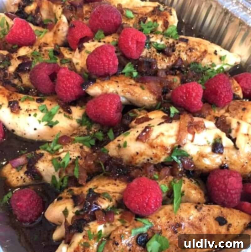 Raspberry Glazed Chicken with Almond Crunch 5 Raspberry balsamic glazed chicken presented in a dish, ready to serve.