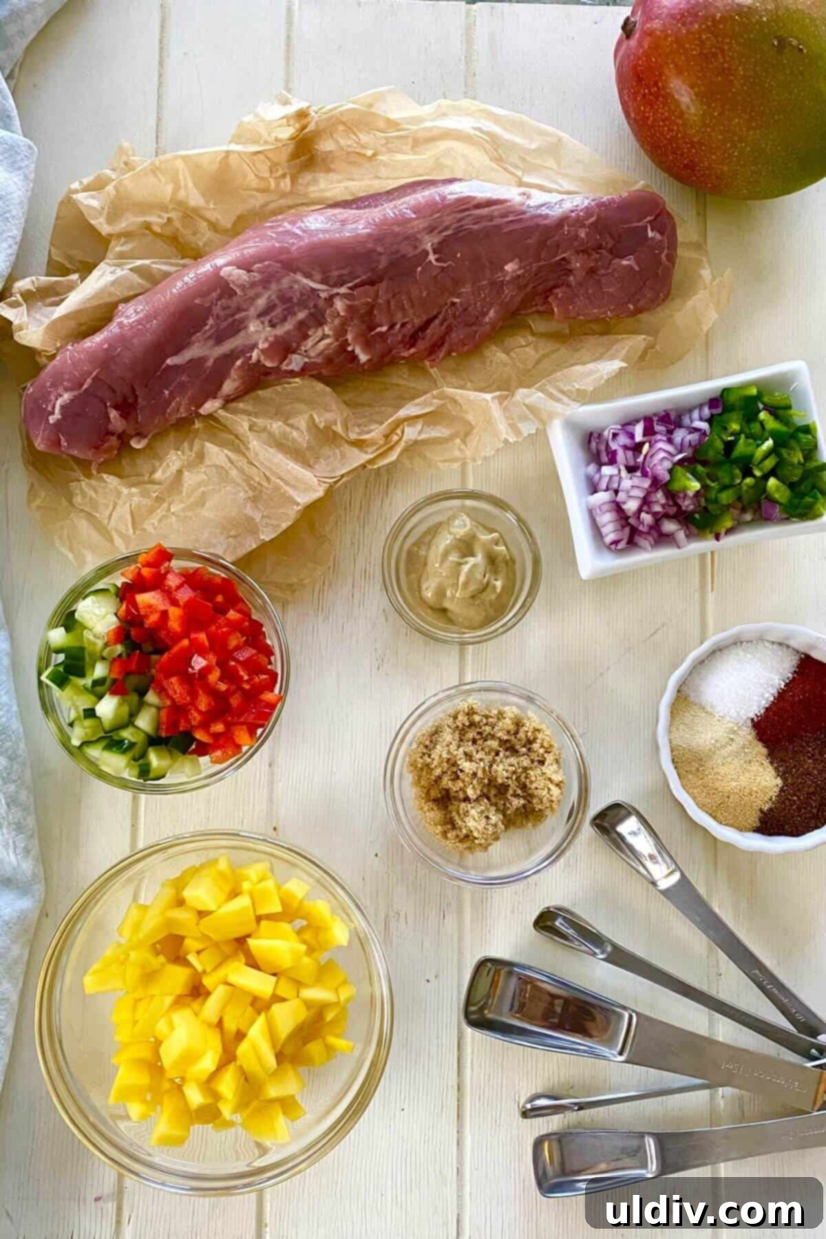 Tropical Heat Pork Tenderloin 3 Pork tenderloin, mango, cucumber, jalapeno, brown sugar, mustard, red pepper.