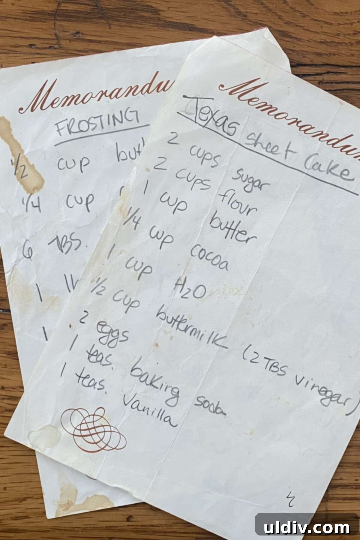 A close-up of a handwritten recipe card for Texas sheet cake, showing its cherished history.