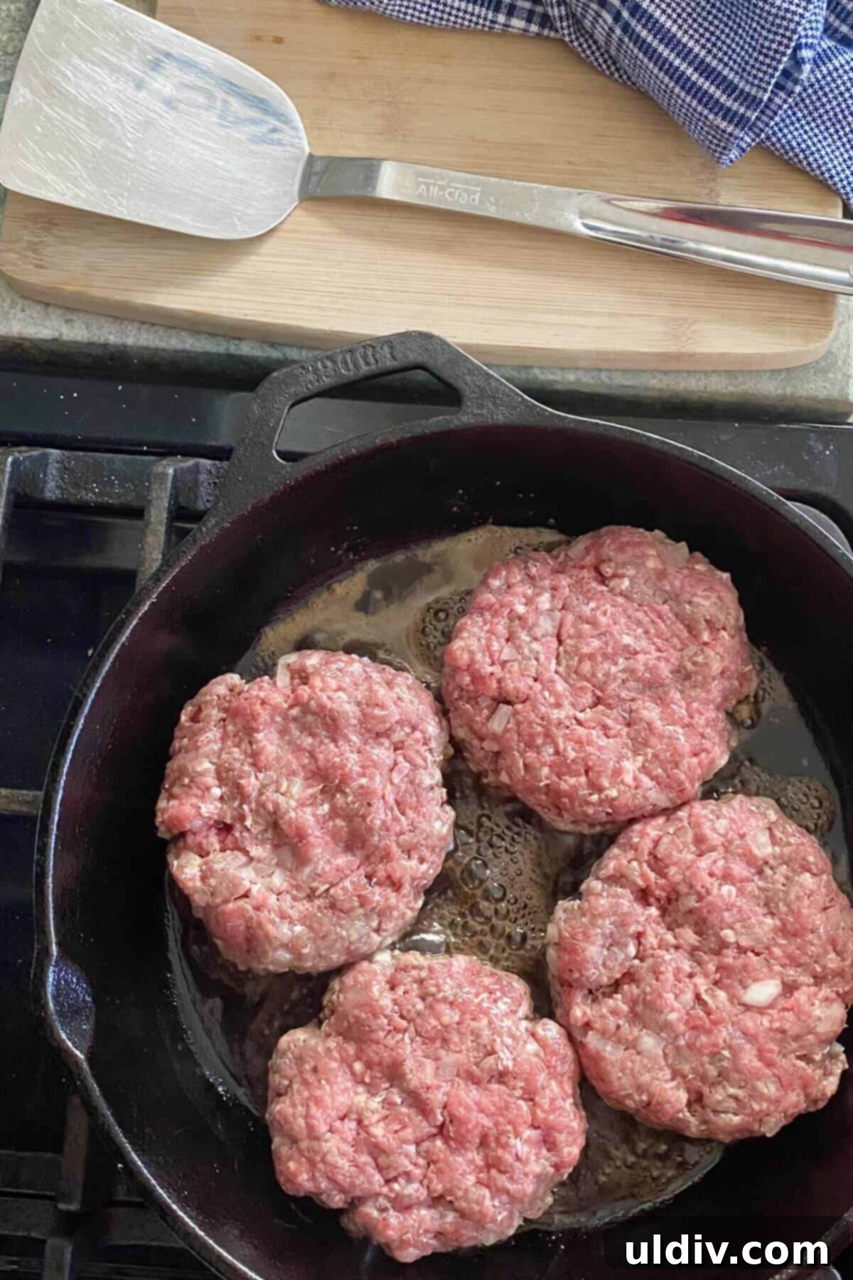 Loaded Big Mac Bowl 5 Cheeseburger patties cooking in a cast iron skillet for the Big Mac Bowls.