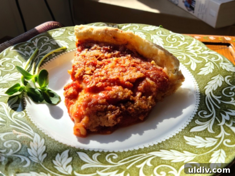 Deep Dive into Chicago Deep Dish 7 A whole Chicago deep dish pizza, perfectly baked with a golden crust and a rich tomato sauce topping, ready to be sliced and served.
