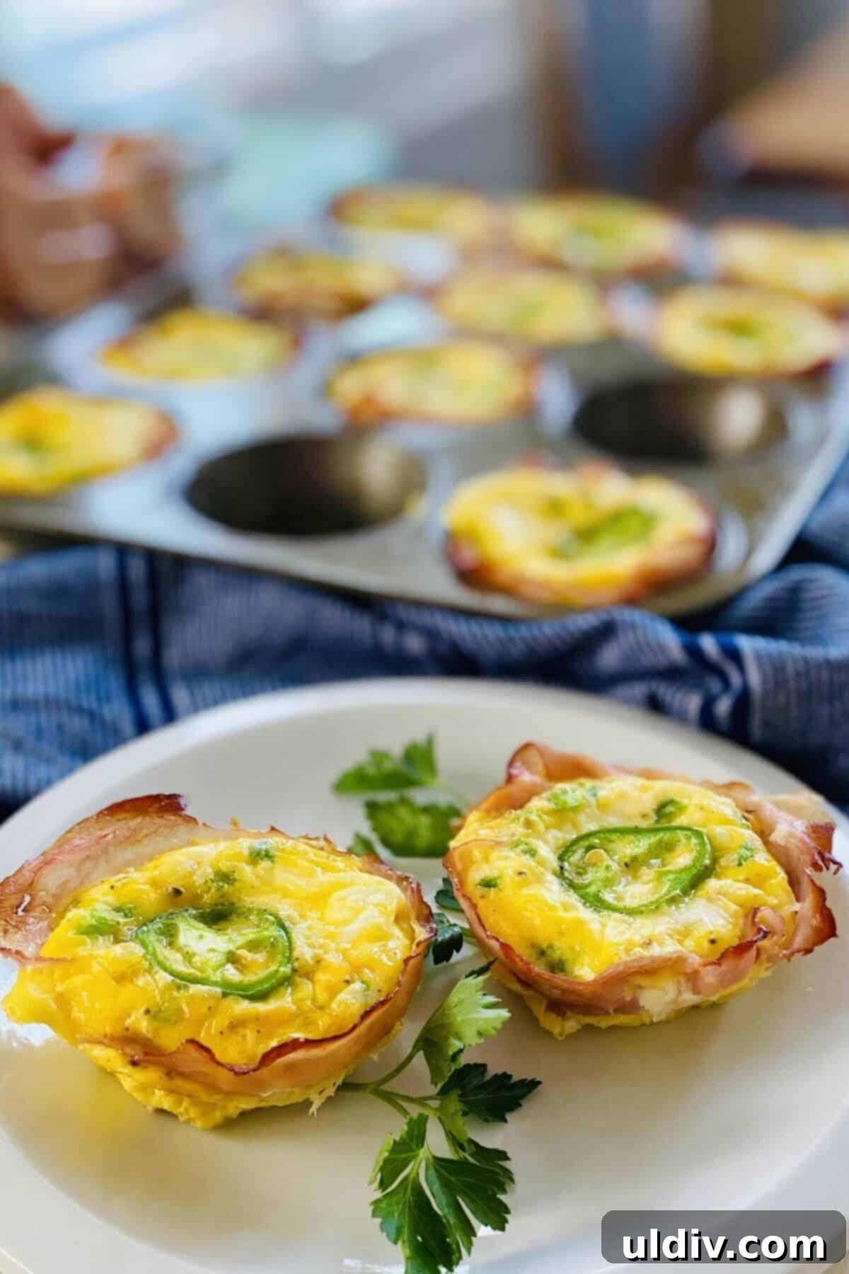 Fiery Popper Breakfast Bites 10 2 jalapeno egg cups on a plate.