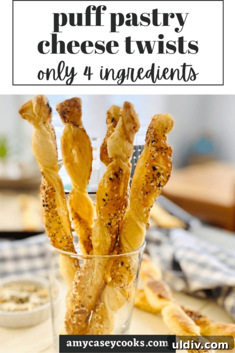 Crispy Everything Bagel Cheese Spirals 11 A close-up of crispy Everything Bagel Puff Pastry Cheese Twists in a glass, ready for serving.