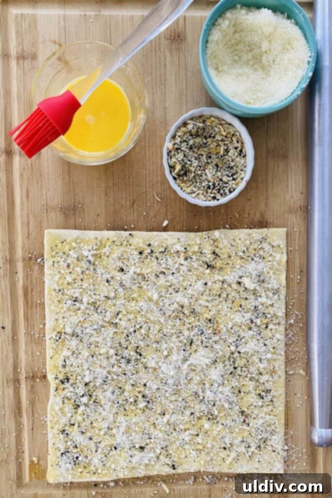 Flaky Everything Bagel Cheese Twists 6 Puff pastry sheet topped with everything bagel seasoning and Parmesan cheese.