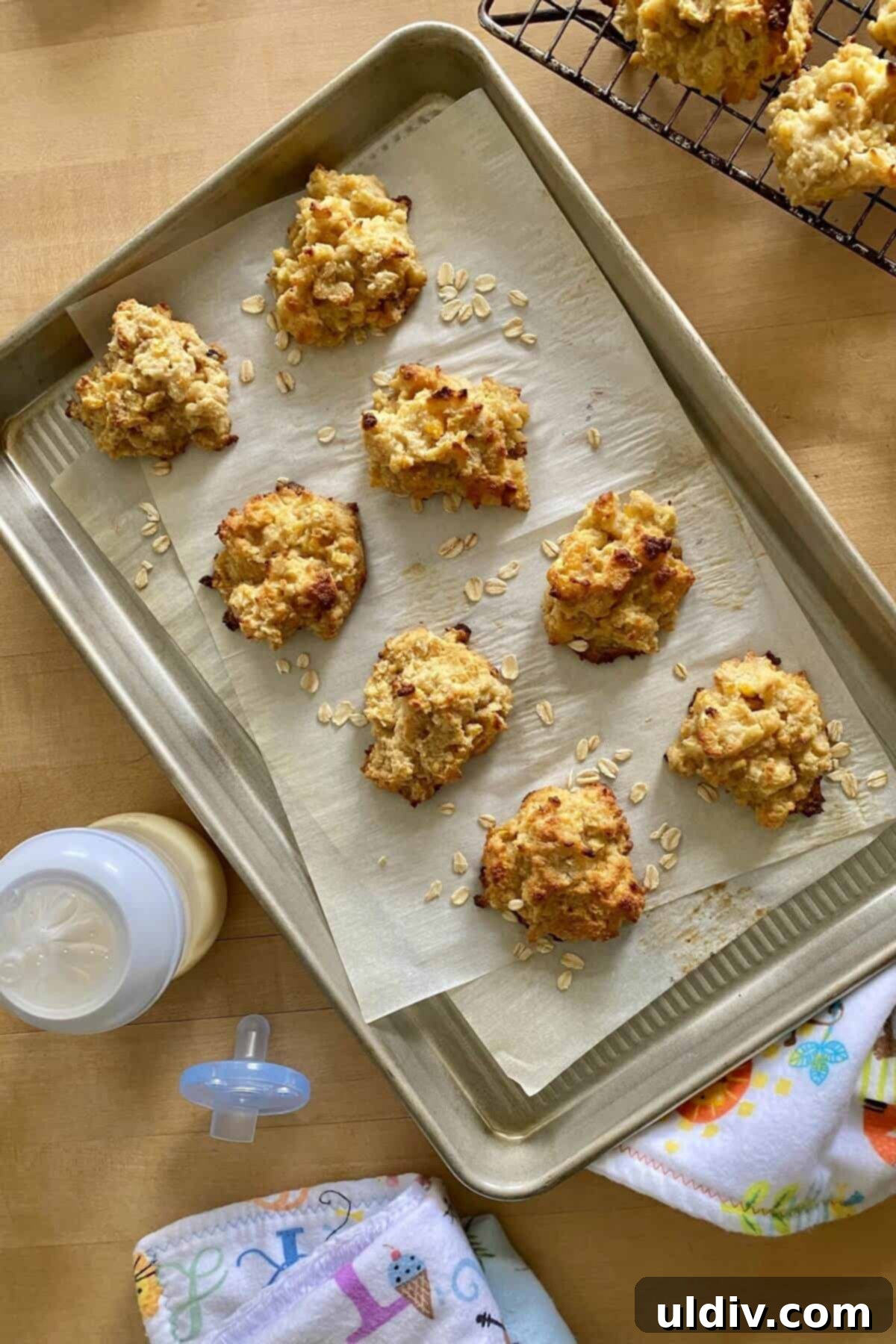 The Best Breastfeeding Lactation Cookie Recipe 5 Eight freshly baked lactation cookies cooling on a baking sheet, illustrating a step in the recipe.