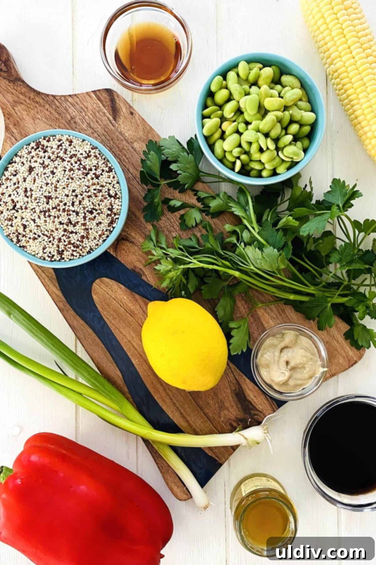 Quinoa Rainbow Salad with Sesame Vinaigrette 3 quinoa, edamame, lemon, red pepper, corn on the cob, soy sauce, sesame oil, all fresh ingredients for tricolor quinoa salad.