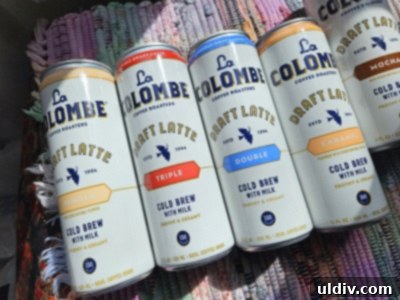 May's Top Product Picks 12 A selection of La Colombe Draft Lattes being enjoyed outdoors, emphasizing portability.
