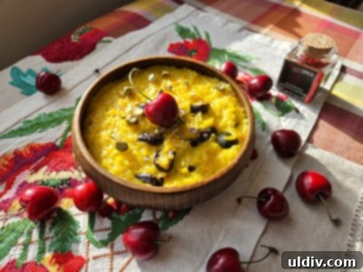 May's Top Product Picks 7 Saffron-infused rice pudding with dried cherries and pistachios, presented in a bowl.